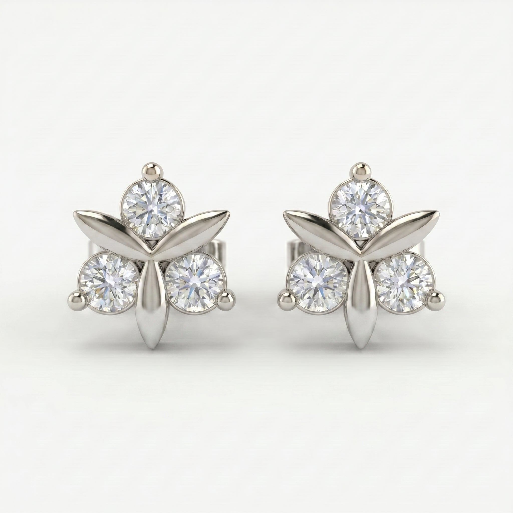 Side profile of minimalist floral stud earrings showing gemstone setting and polished rose gold craftsmanship