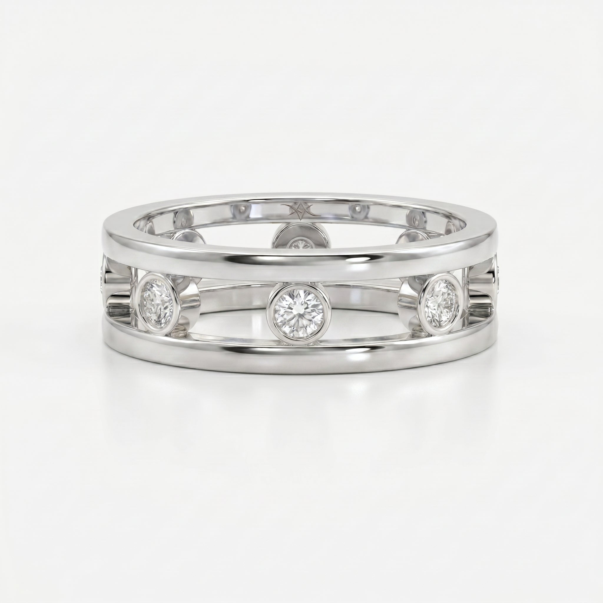 Top view of modern diamond band ring with open structure and bezel set round brilliant diamonds