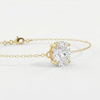 Luxury oval diamond bracelet in yellow gold shown at 45-degree angle with elegant sparkle and fine chain