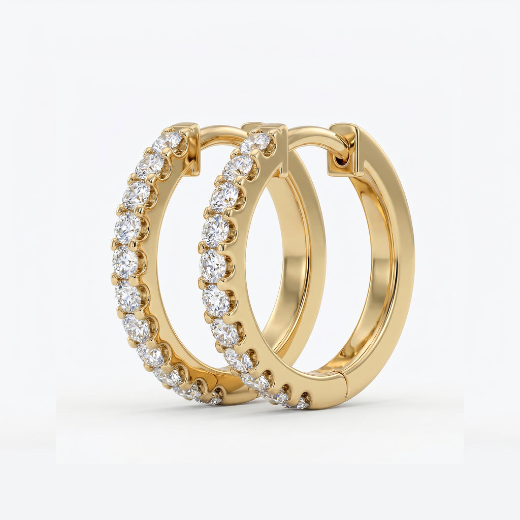 Macro detail of pavé-set round diamonds on luxury rose gold huggie hoop earrings with brilliant sparkle