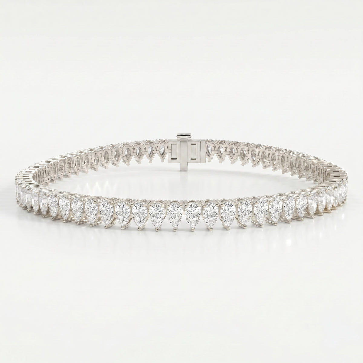 Macro detail of pear shaped diamonds highlighting brilliance clarity and premium gold prong setting