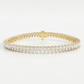 Pear-cut diamond tennis bracelet in yellow gold with elegant shared-prong setting and secure box clasp