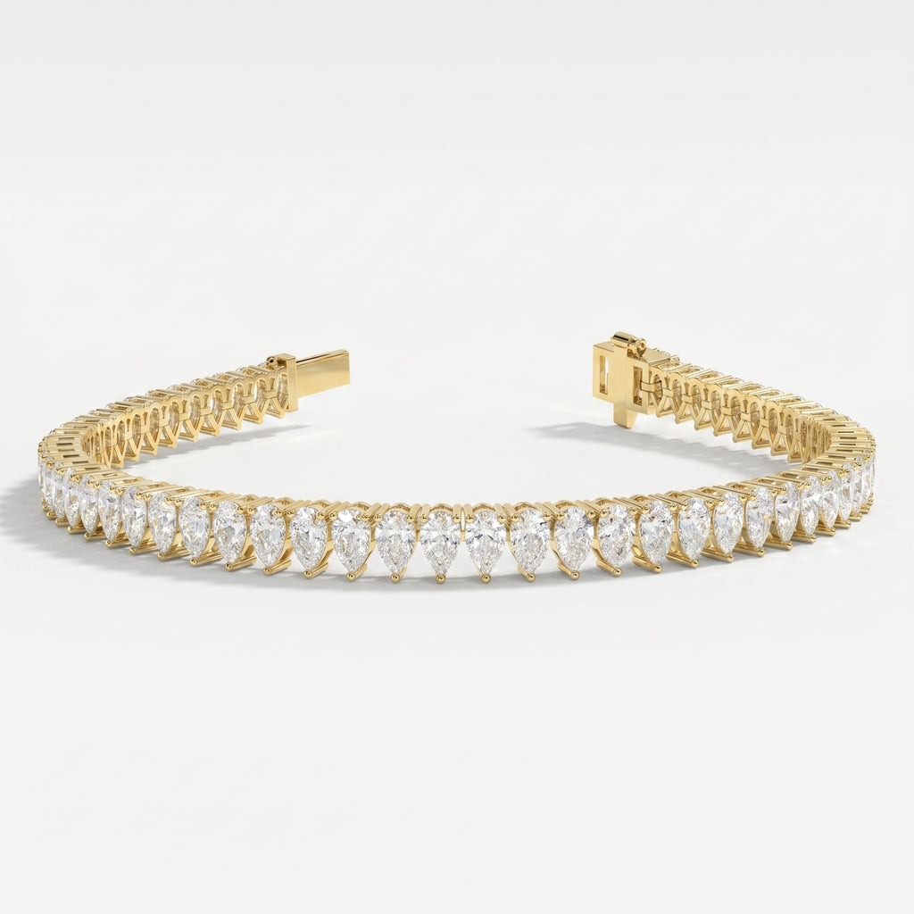Top view of pear-cut diamond tennis bracelet in yellow gold displaying full diamond arrangement and symmetry