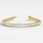 Top view of pear-cut diamond tennis bracelet in yellow gold displaying full diamond arrangement and symmetry