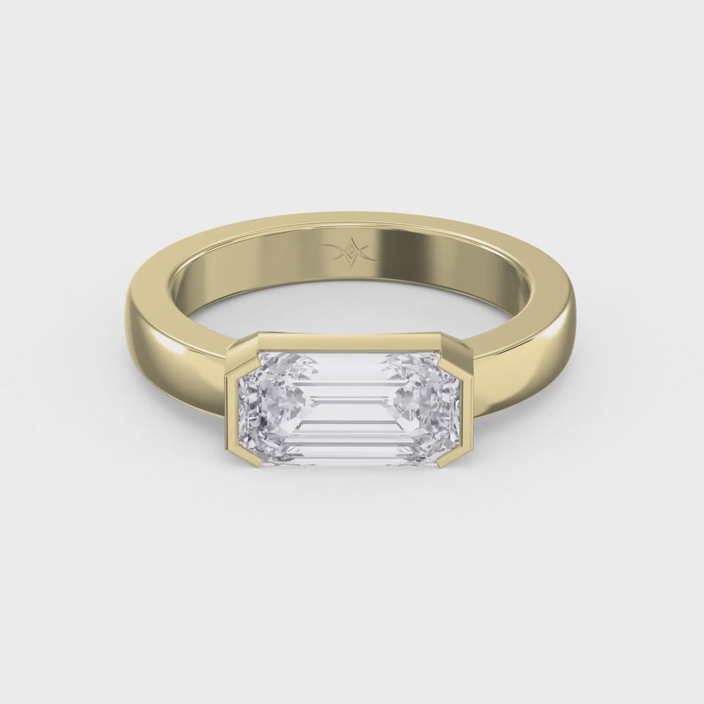 Bar Channel Setting Emerald Shape Diamond Solitaire Ring