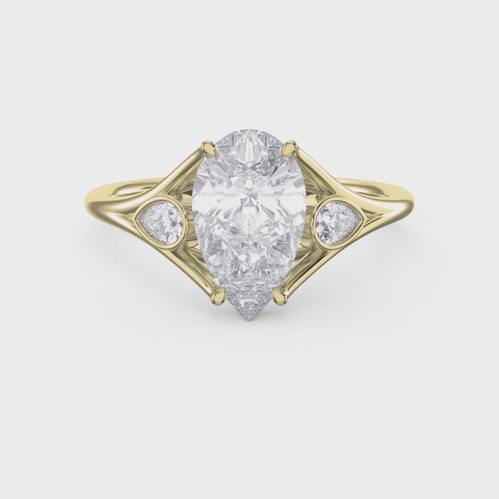 Custom 4‑Prong Diamond Ring with Bezel‑Set Pear Side Stones