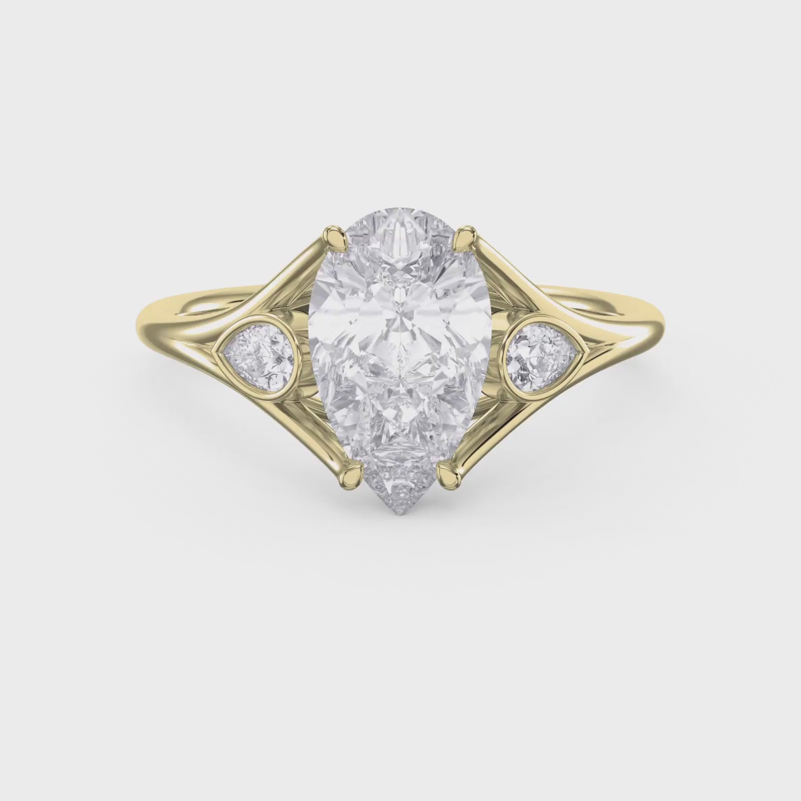 Custom 4‑Prong Diamond Ring with Bezel‑Set Pear Side Stones