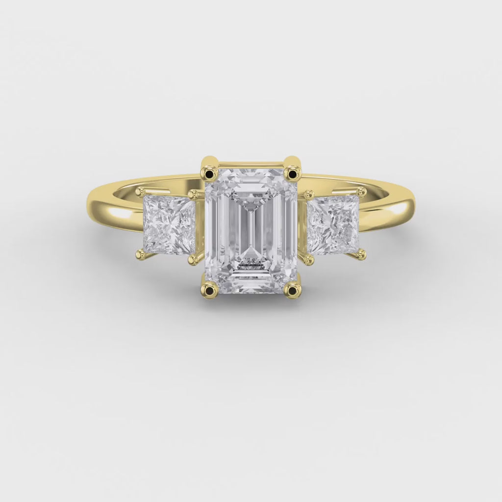 The Axis Trio Emerald Ring