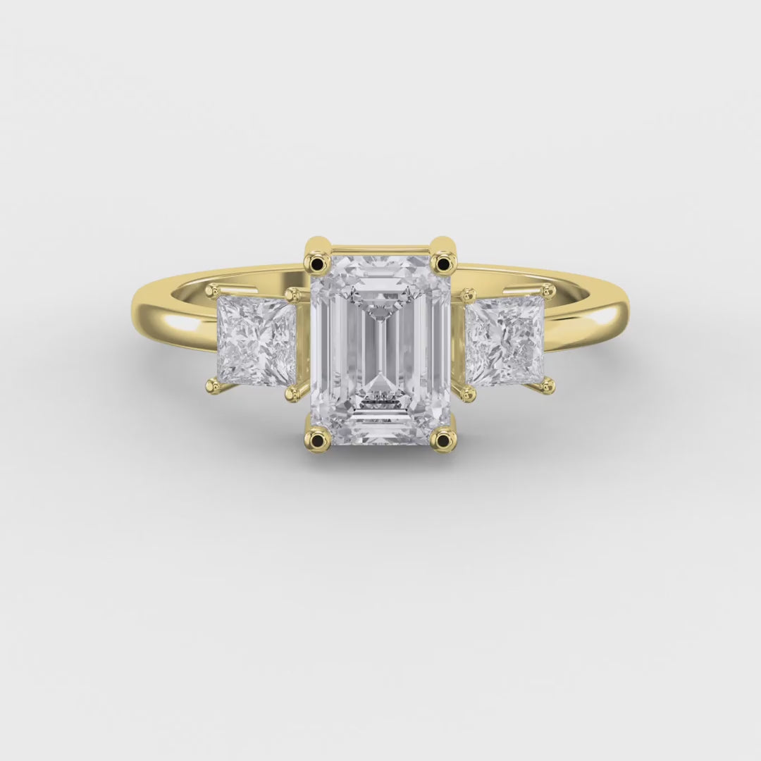 The Axis Trio Emerald Ring