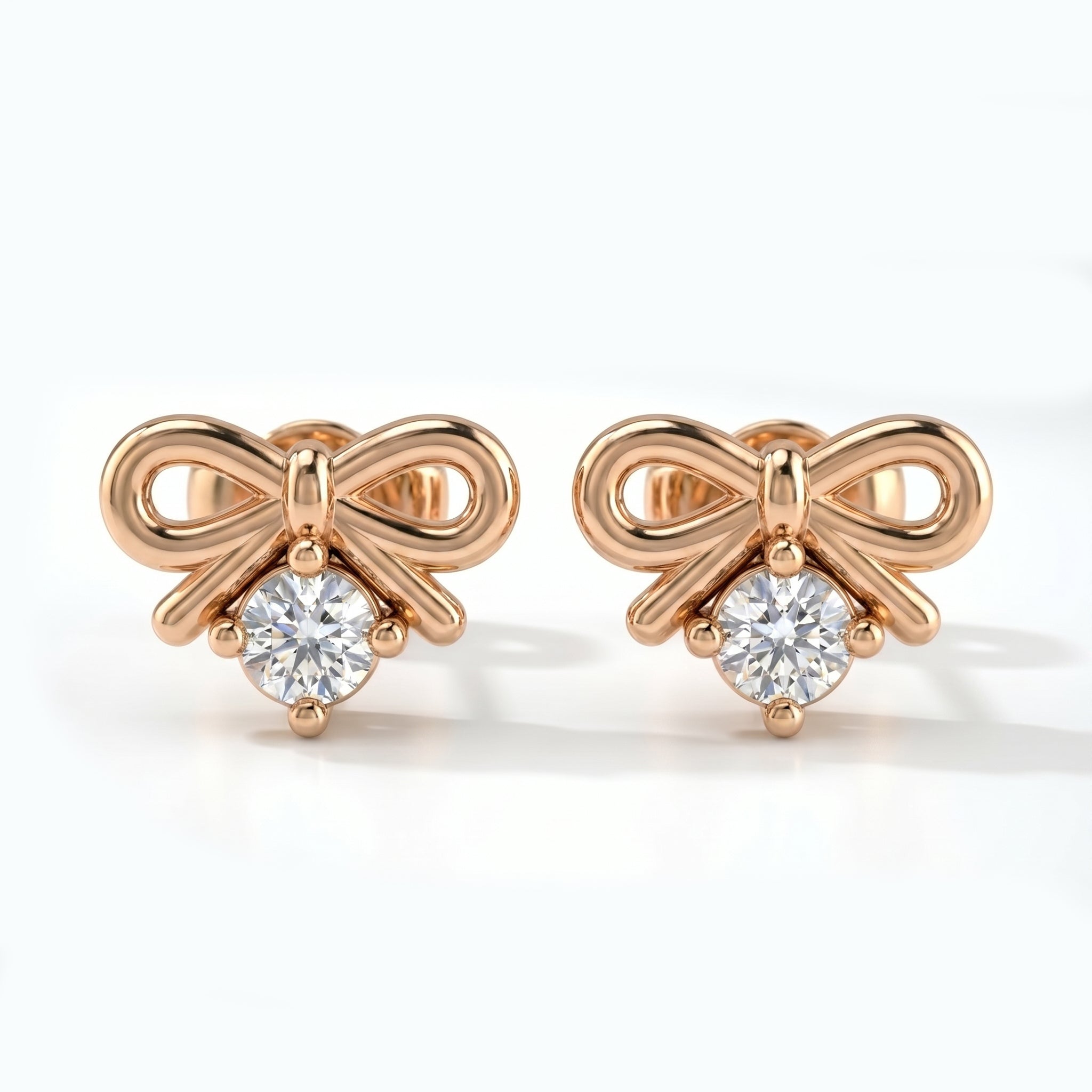 Rose gold bow stud earrings with round solitaire crystal on white background in minimalist luxury style