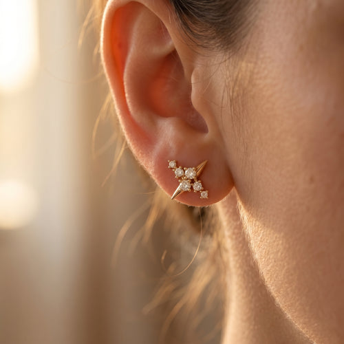 Macro side profile of rose gold diamond stud earrings showing polished finish and fine prong craftsmanship