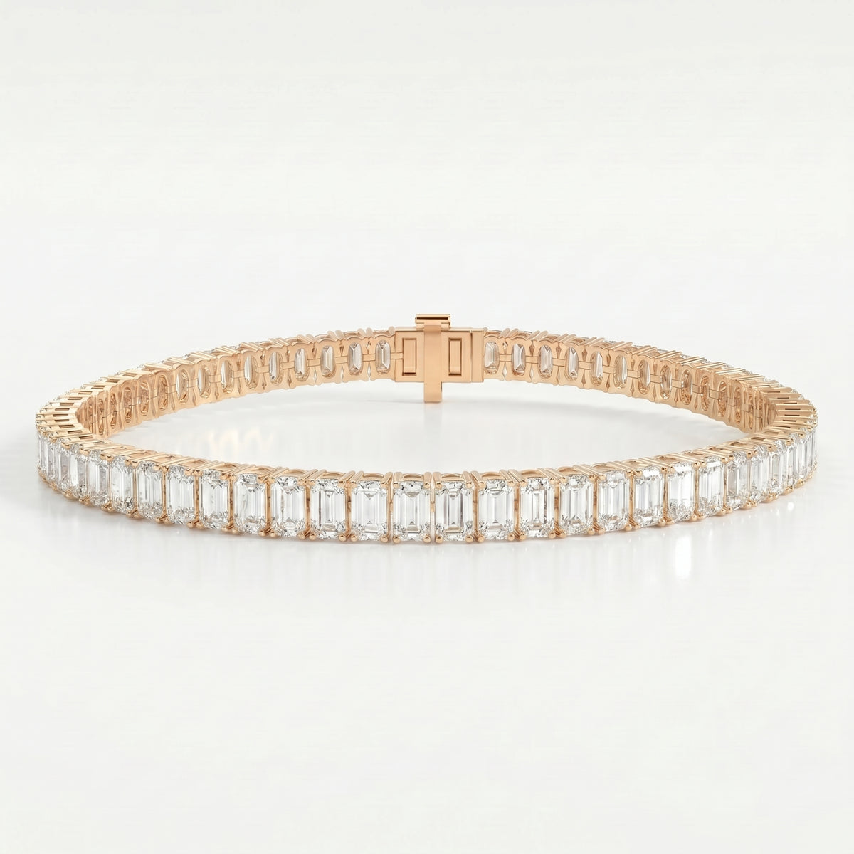 Rose gold emerald cut diamond tennis bracelet featuring a full eternity design with secure clasp and brilliant diamonds.