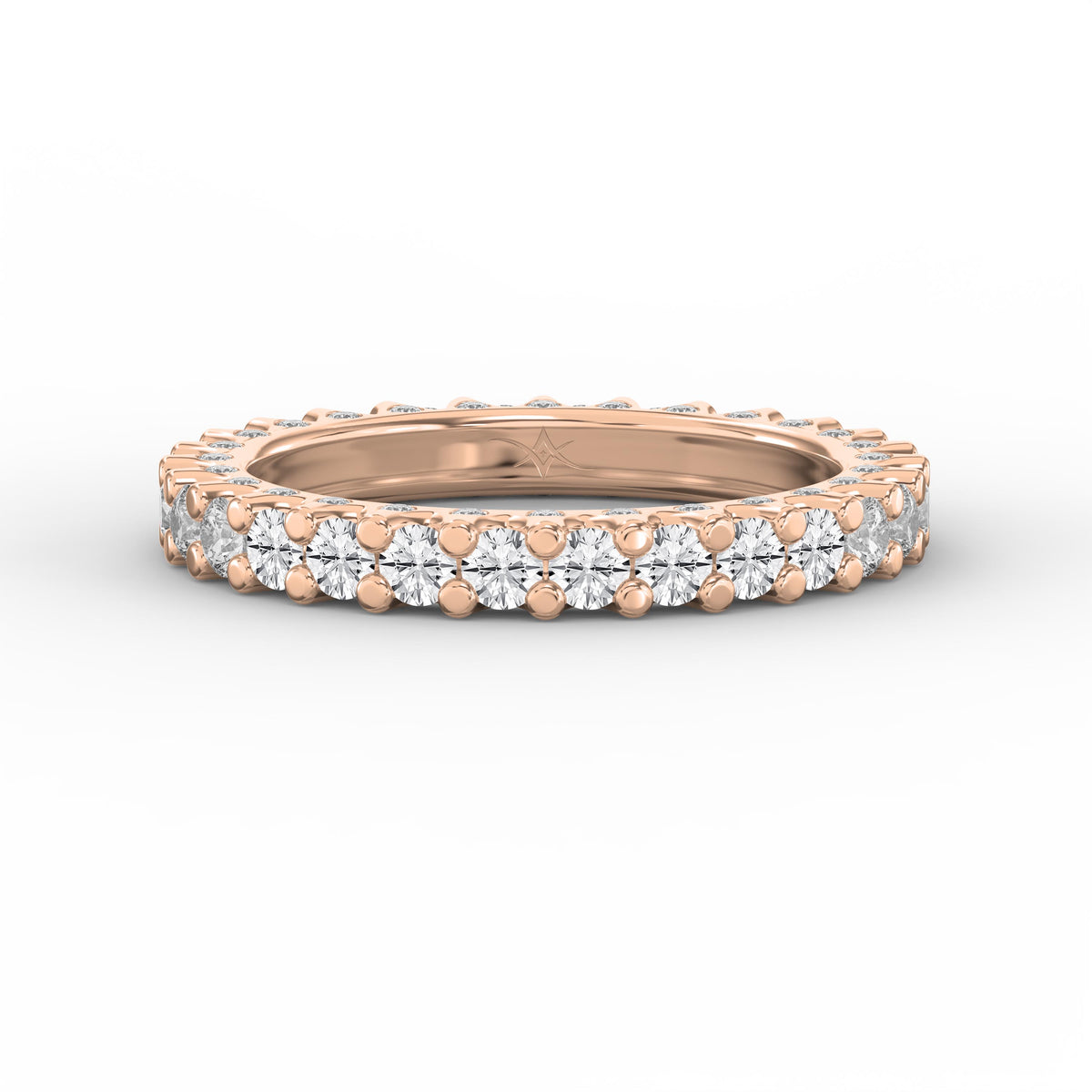 Rose gold eternity band featuring round brilliant diamonds in a shared prong setting on a clean white background.