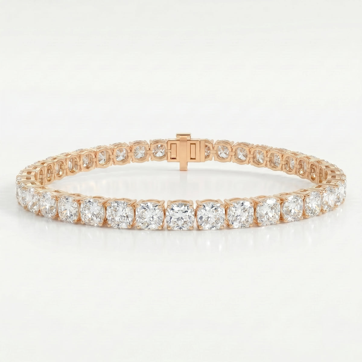 Rose gold tennis bracelet with round brilliant-cut stones in secure prong setting on clean white background
