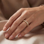 Round diamond eternity band in yellow gold with shared prong setting and brilliant lab grown diamonds.