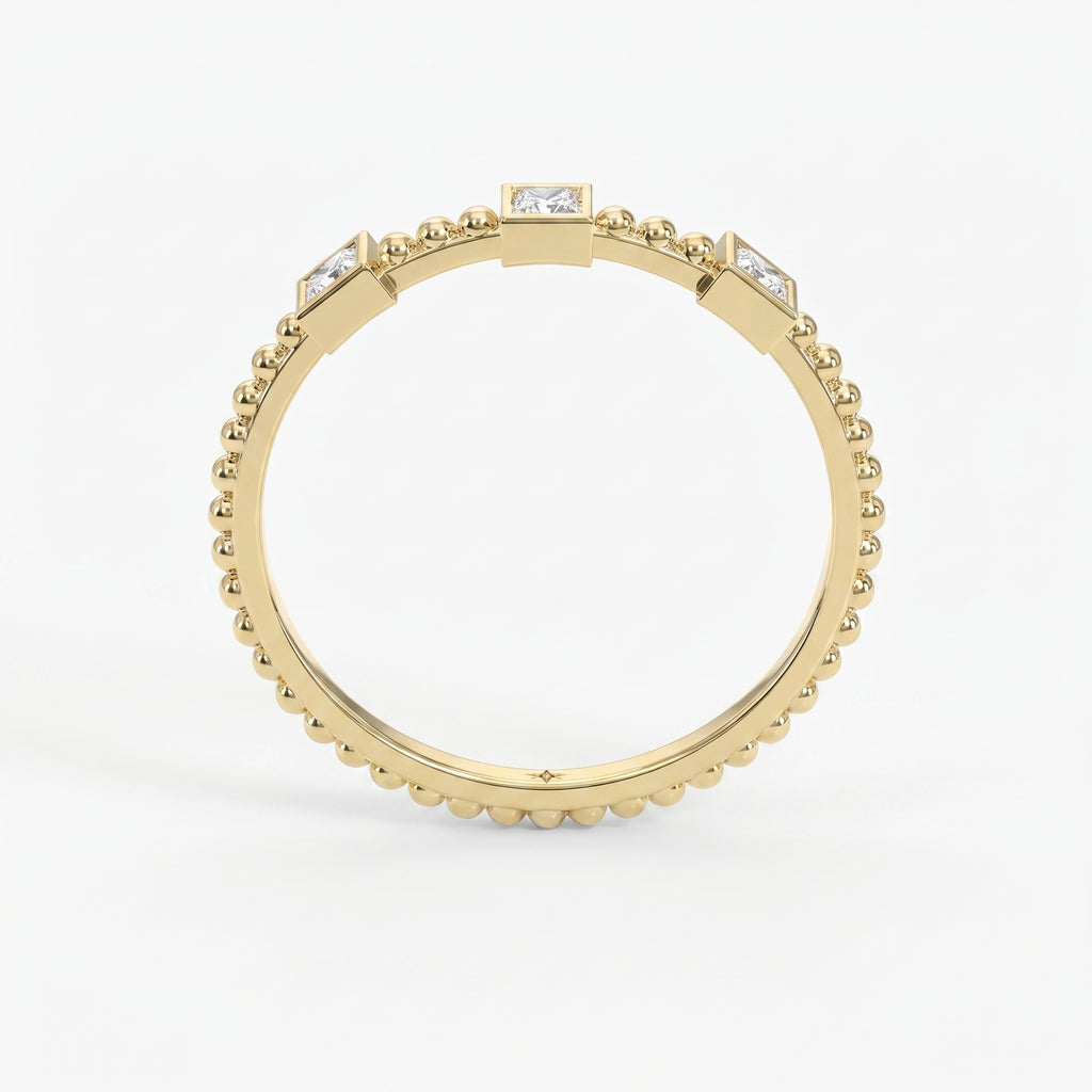 Three-stone princess-cut diamond beaded gold ring with bezel settings on a clean white luxury jewelry background
