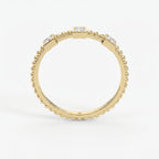 Three-stone princess-cut diamond beaded gold ring with bezel settings on a clean white luxury jewelry background