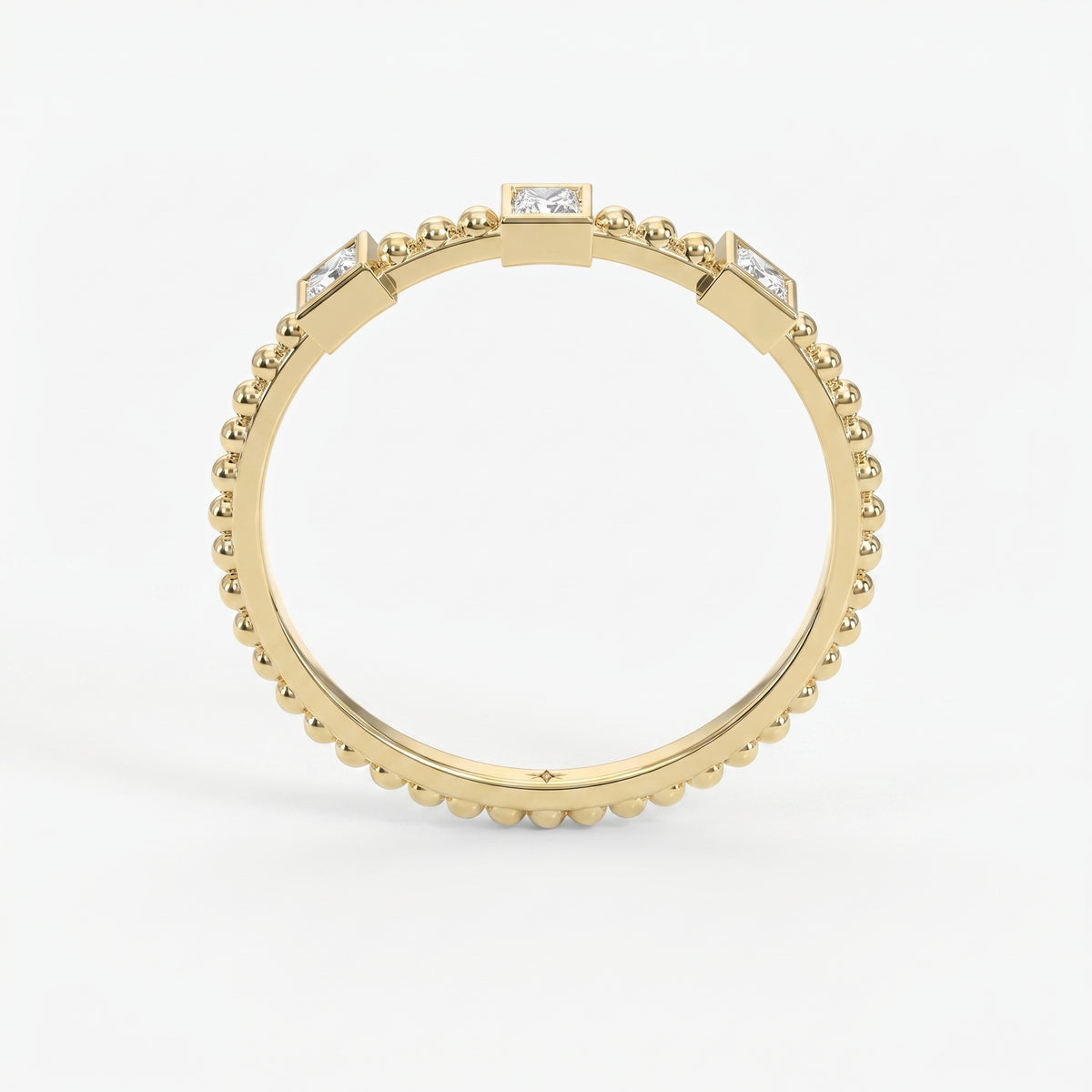 Three-stone princess-cut diamond beaded gold ring with bezel settings on a clean white luxury jewelry background