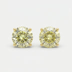 Round yellow diamond stud earrings in yellow gold setting on white background with brilliant sparkle and luxury finish