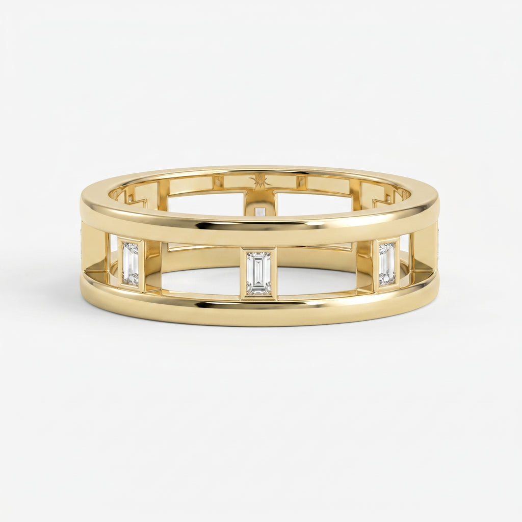 Luxury yellow gold open band ring featuring bezel-set Emerald diamonds and modern geometric architectural design.