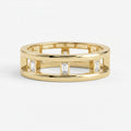 Luxury yellow gold open band ring featuring bezel-set Emerald diamonds and modern geometric architectural design.