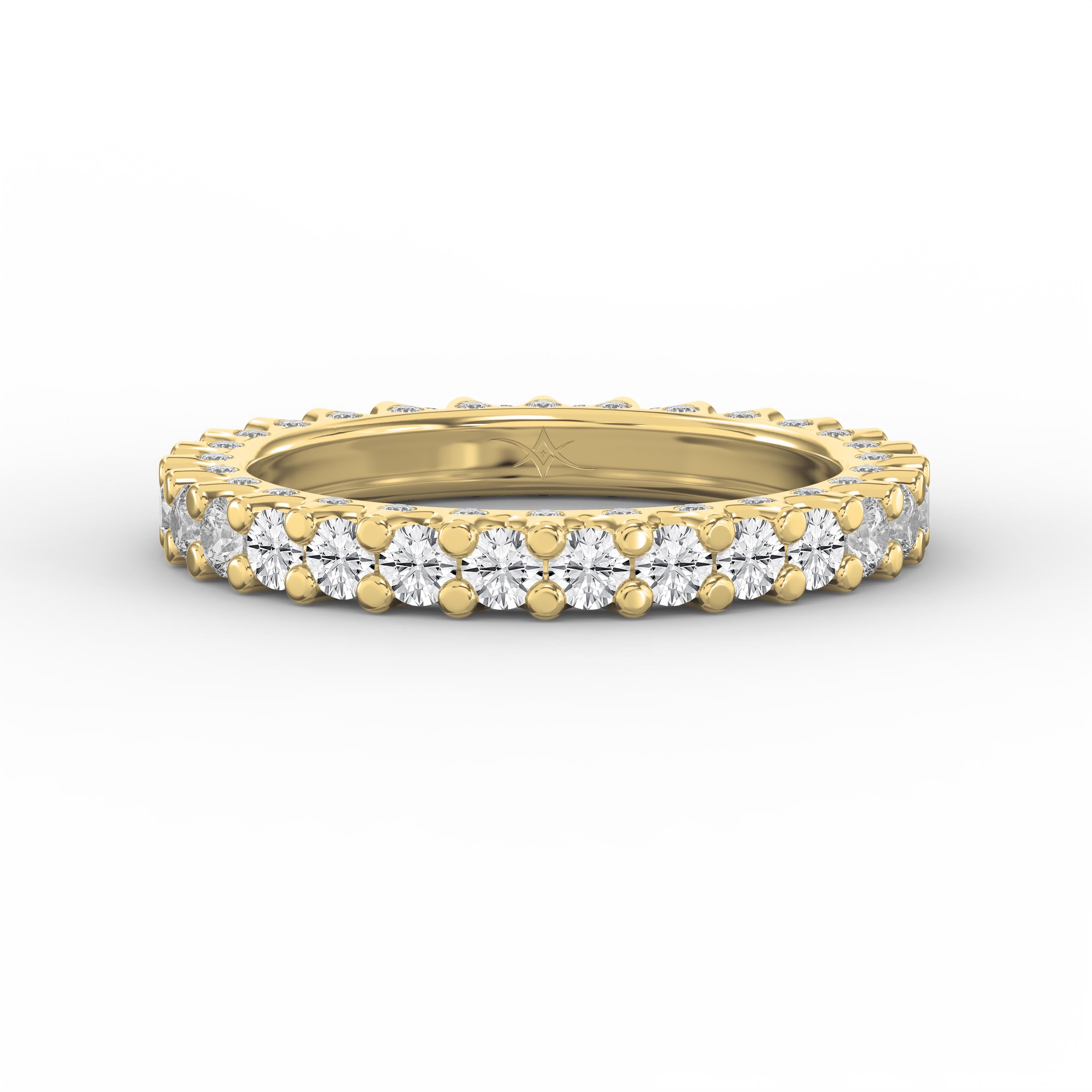 Yellow gold full eternity diamond ring with round brilliant diamonds in a shared prong setting on a pure white background.
