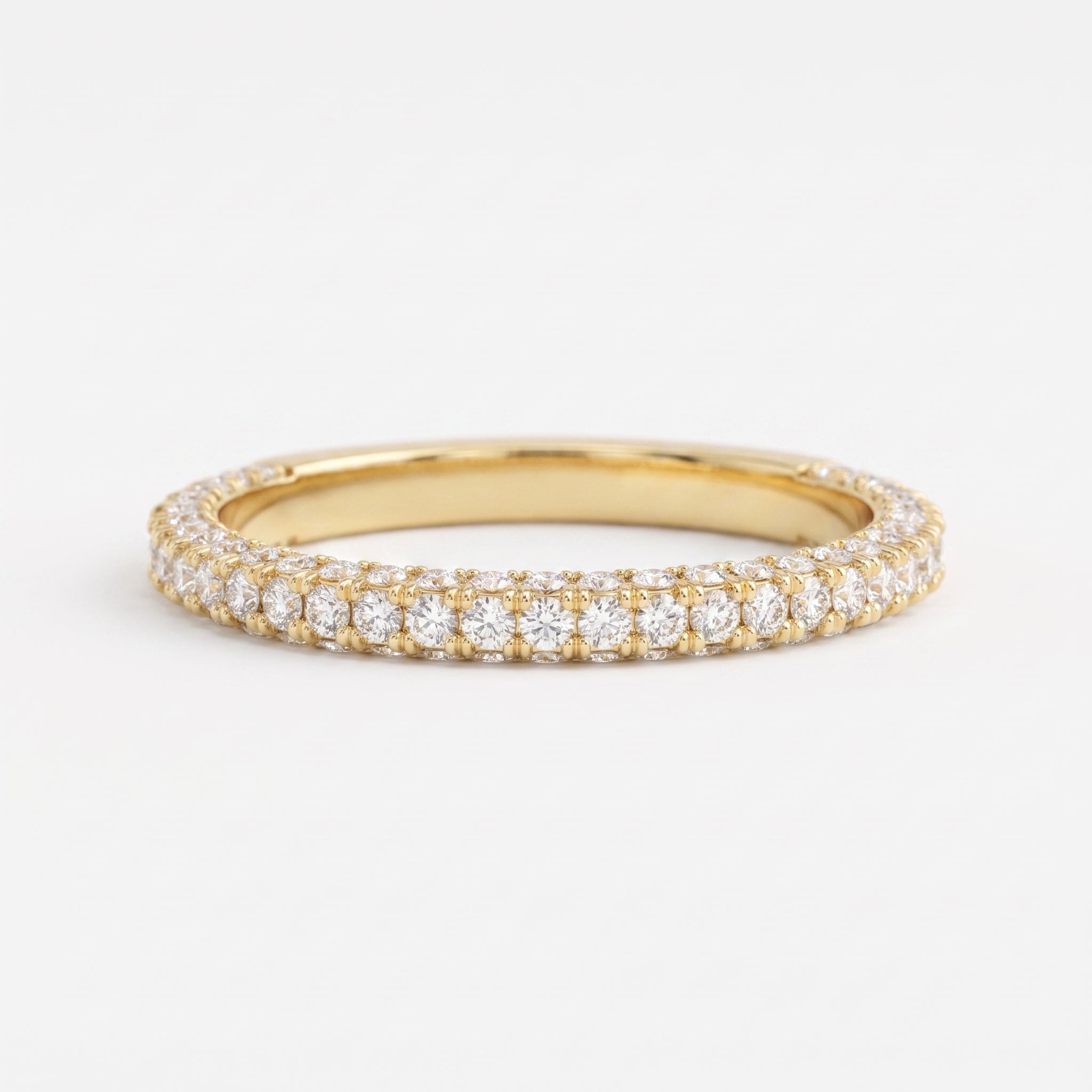 Yellow gold diamond eternity ring with round brilliant diamonds in a full eternity band, luxury wedding and stackable ring.