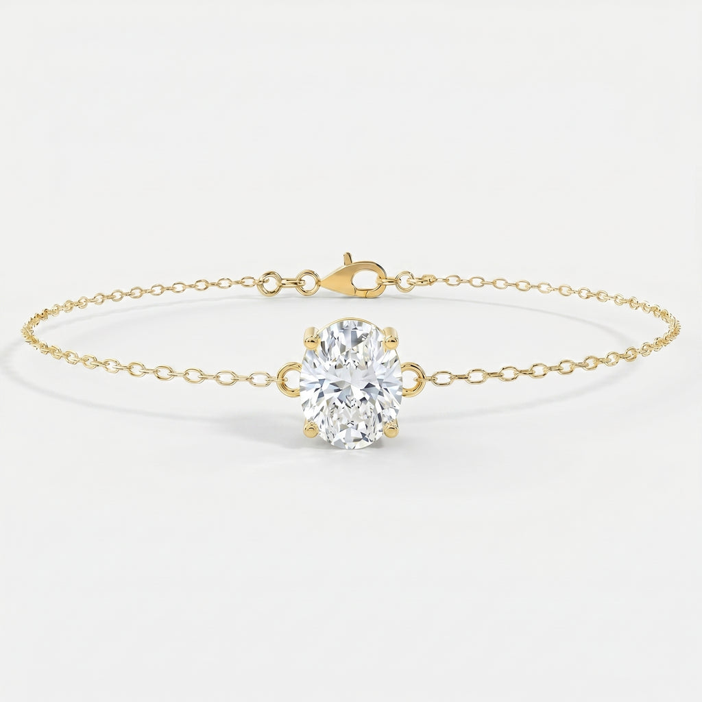 Side profile of oval diamond bracelet showing four-prong yellow gold setting and delicate chain craftsmanship