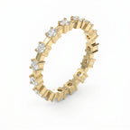 Top view of yellow gold eternity ring featuring round brilliant diamonds around the entire band