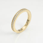 Premium yellow gold eternity ring featuring brilliant diamonds and vintage milgrain edges at a 45 degree angle