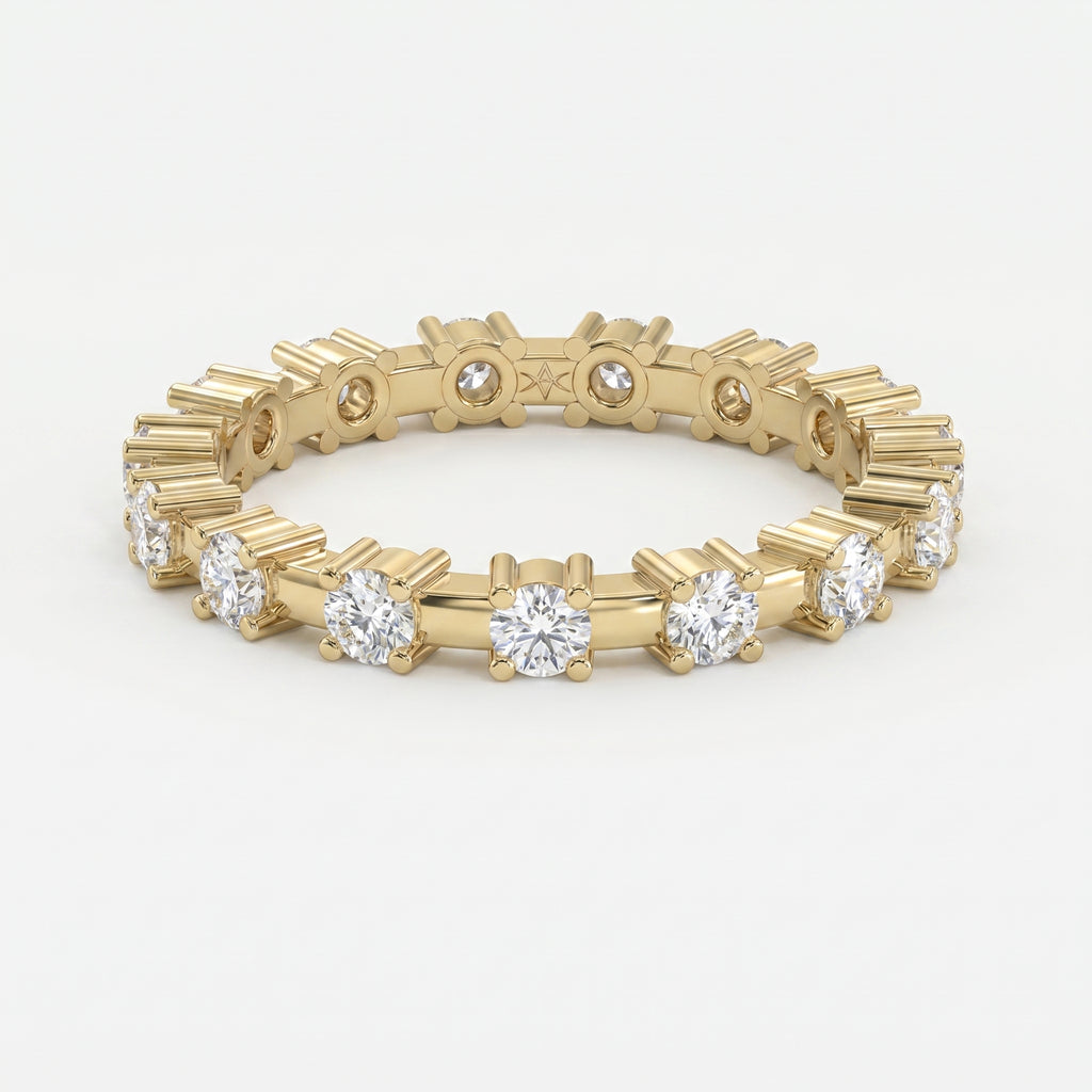 Yellow gold diamond eternity band with round brilliant diamonds in a modern shared-prong setting on white background