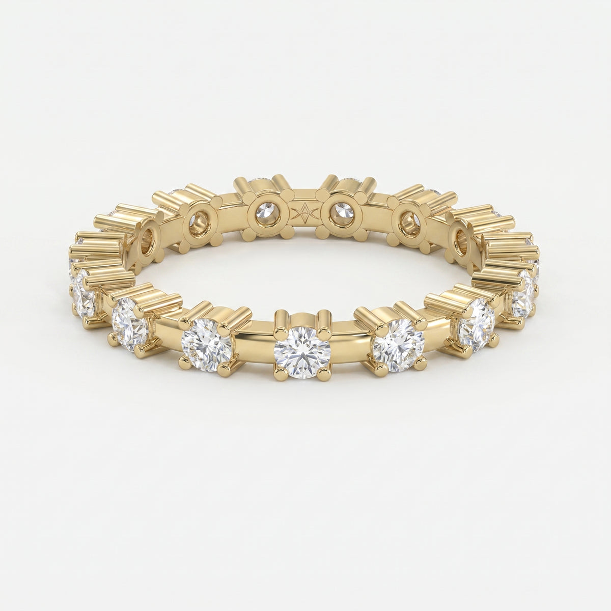 Yellow gold diamond eternity band with round brilliant diamonds in a modern shared-prong setting on white background
