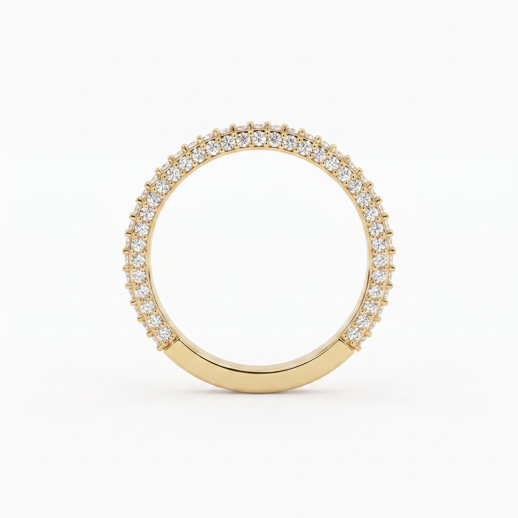 Front view of a yellow gold diamond eternity band featuring brilliant round diamonds in a premium shared prong setting.