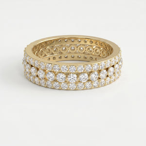 Yellow gold diamond eternity band with three rows of round brilliant diamonds on a pure white background