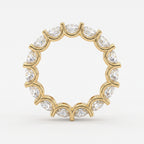 Close-up of round brilliant diamonds in a yellow gold eternity band showcasing sparkle, precision cut, and premium craftsmanship.