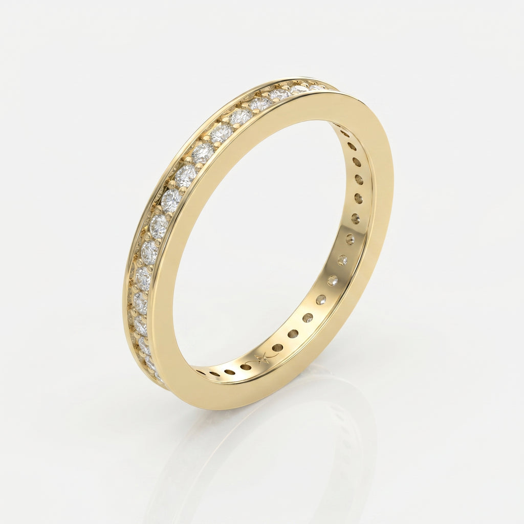Top view of yellow gold eternity ring featuring round brilliant diamonds in a sleek stacking band design