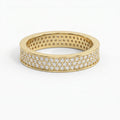 Yellow gold diamond pavé eternity band with brilliant round diamonds in a luxury wide-band design on white background