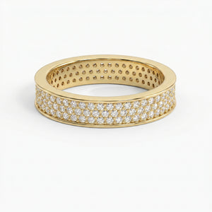 Yellow gold diamond pavé eternity band with brilliant round diamonds in a luxury wide-band design on white background