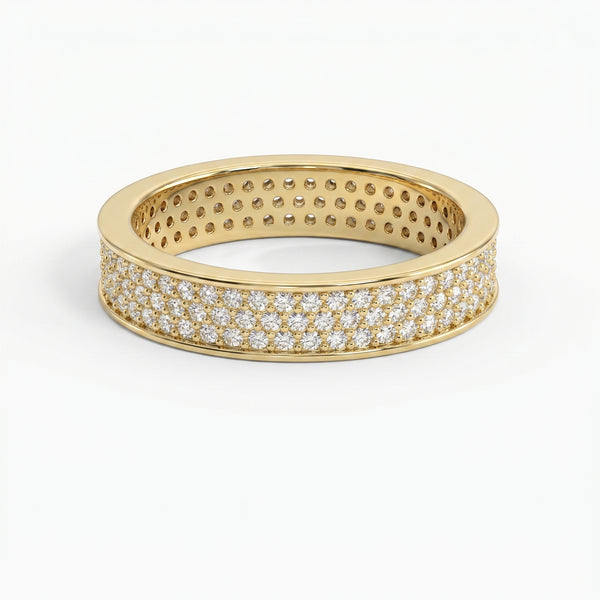 Yellow gold diamond pavé eternity band with brilliant round diamonds in a luxury wide-band design on white background
