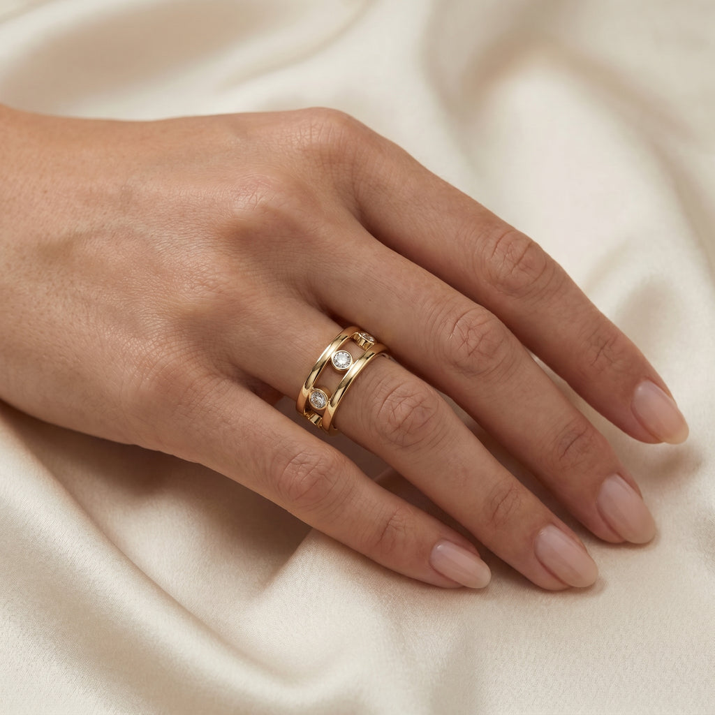 Macro detail of bezel-set diamonds in polished yellow gold ring showing luxury craftsmanship and sparkle