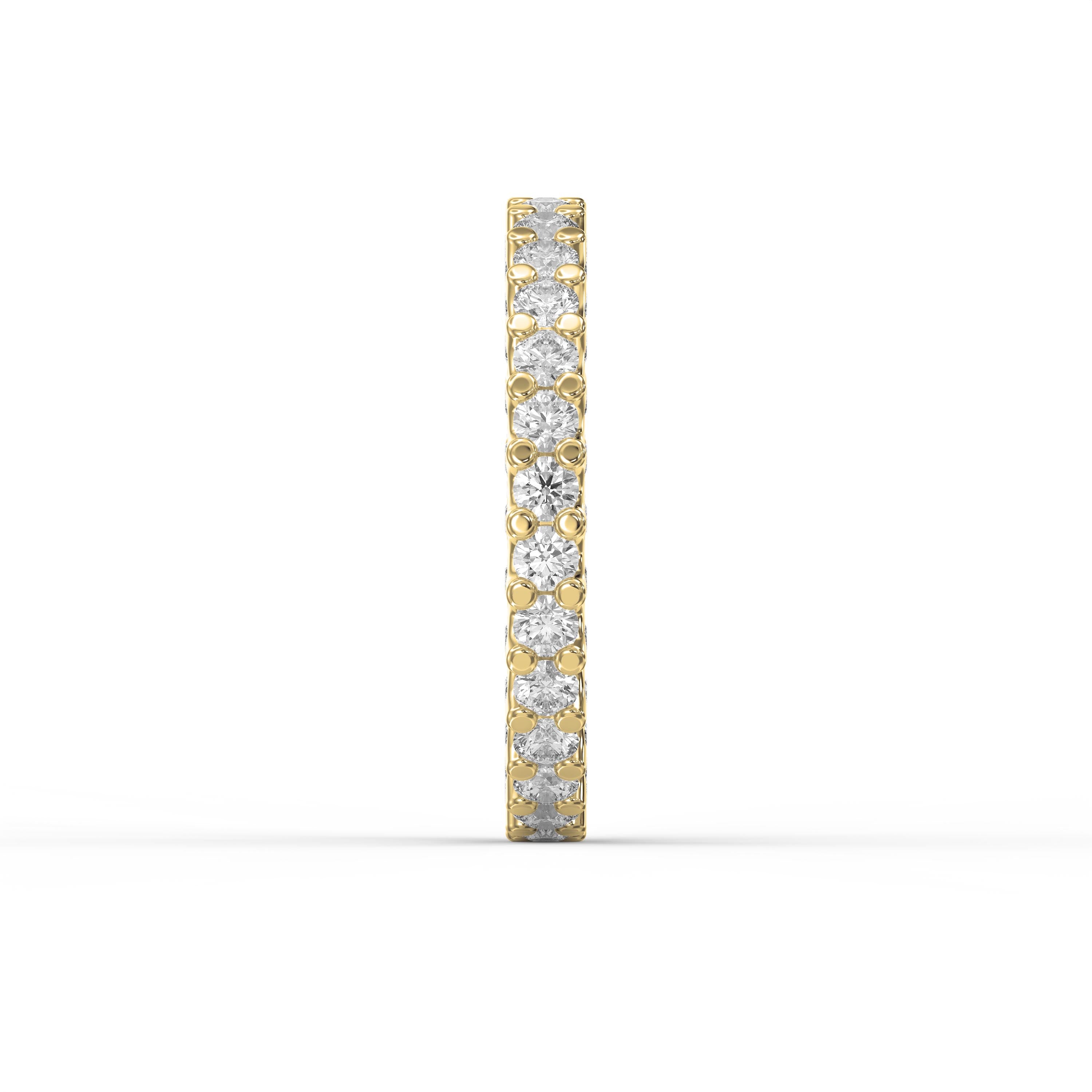  Side profile of a yellow gold eternity band showcasing shared prong diamond setting and polished gold finish.