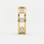 Side profile of yellow gold open-gallery diamond ring highlighting bezel settings and architectural design.
