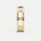 Side profile of yellow gold openwork ring featuring Baguette diamond accents and architectural band design.