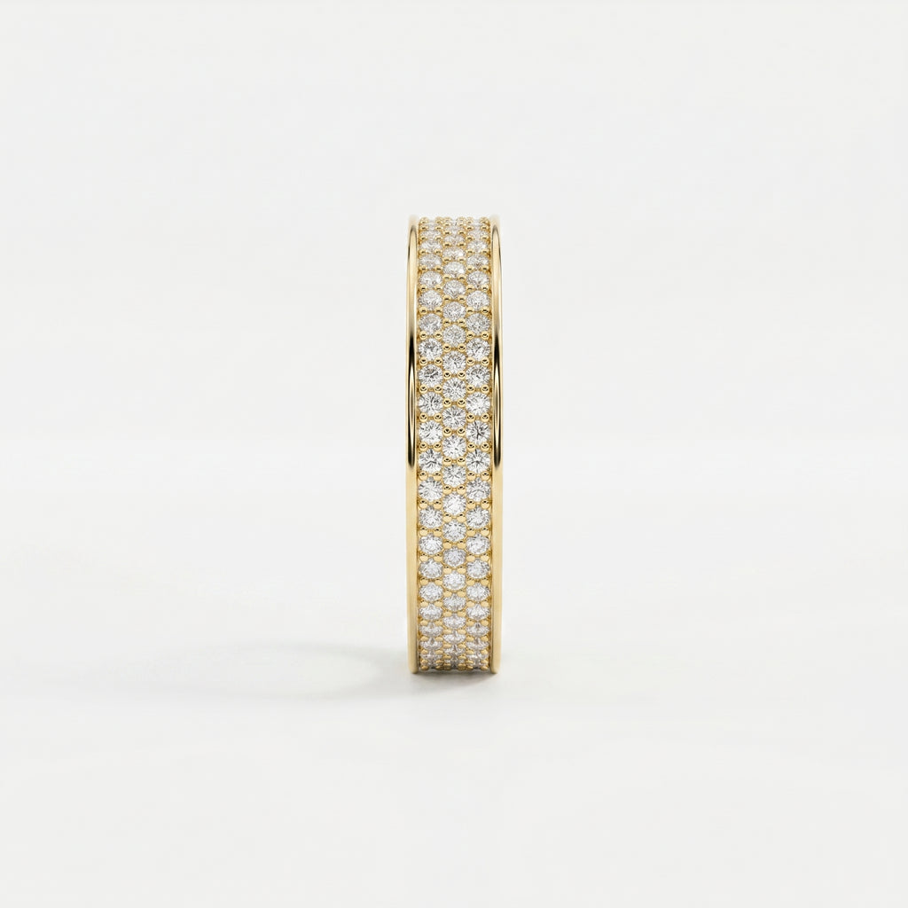 Side profile of yellow gold diamond eternity band showing pavé setting and elegant wide-band construction