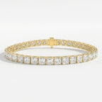Luxury yellow gold princess cut tennis bracelet with sparkling square diamonds and secure box clasp on white background