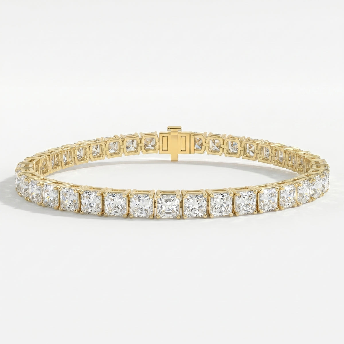 Luxury yellow gold princess cut tennis bracelet with sparkling square diamonds and secure box clasp on white background