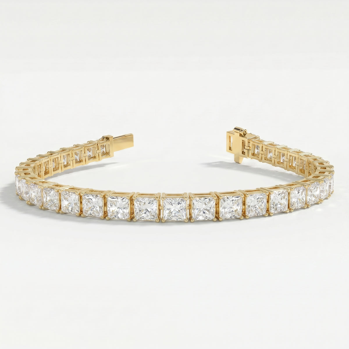 Side profile of yellow gold tennis bracelet displaying secure prong settings and princess cut diamond structure