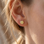 Side profile of yellow stone stud earrings showing detailed prong basket setting and craftsmanship