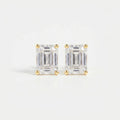 Pair of diamond stud earrings on a light gray background