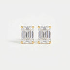 Pair of diamond stud earrings on a light gray background